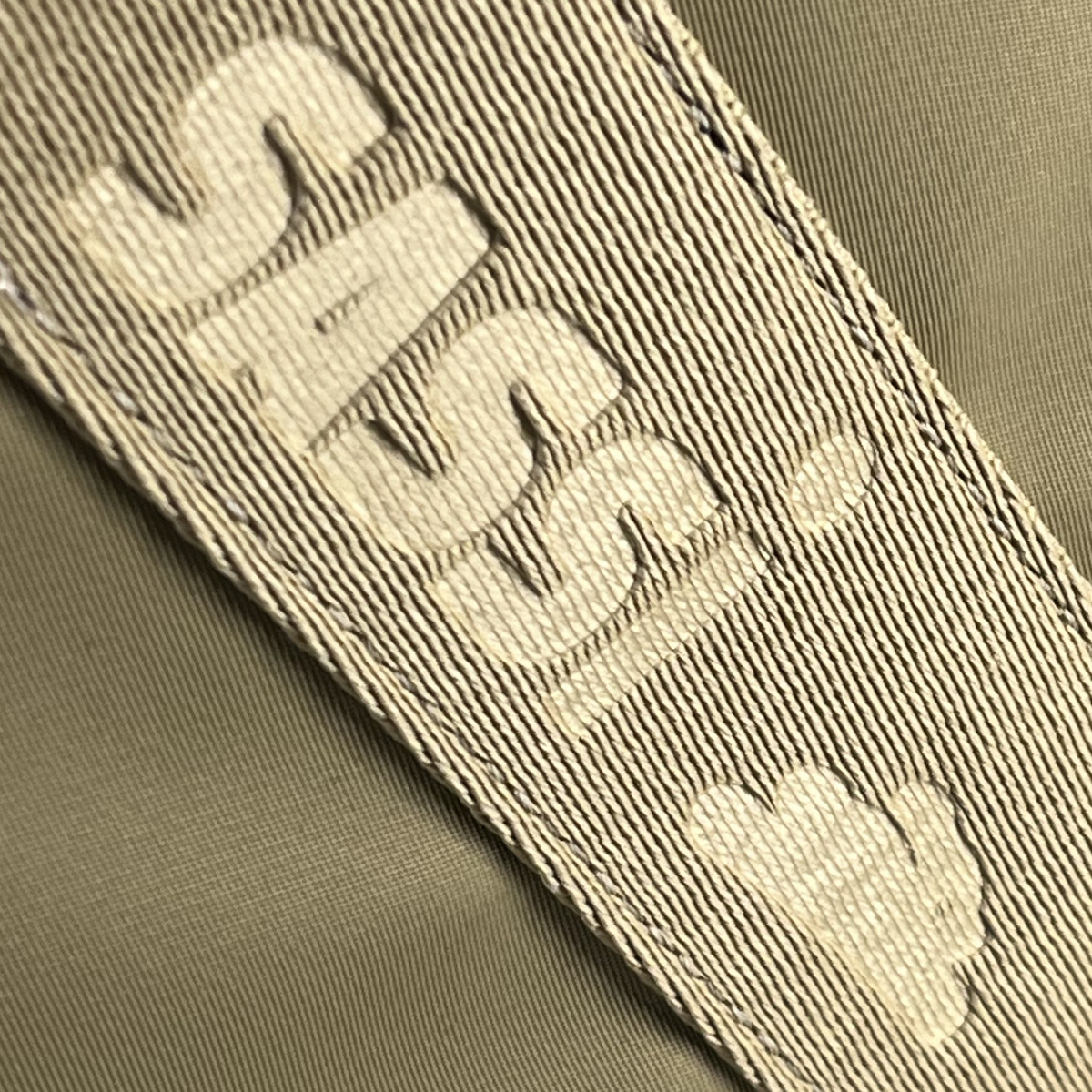 Artemis Tote — Beige - Artemis logo detail close-up